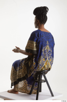  Dina Moses  1 dressed sitting traditional decora long african dress whole body 0010.jpg